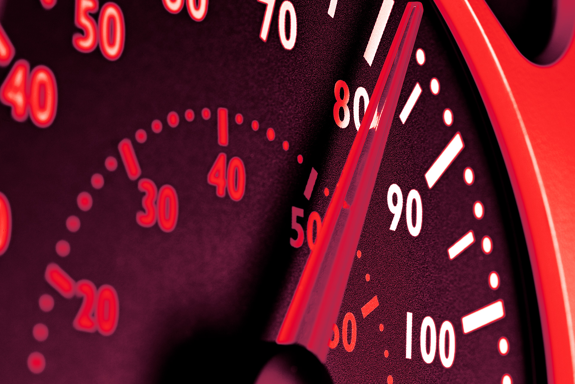speedometer on a red background